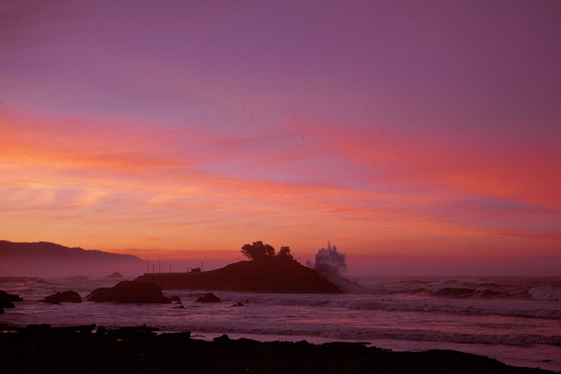 photo of wave as high as the light house
